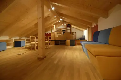 a living room with a couch and a table at Mühlerhof in Funes