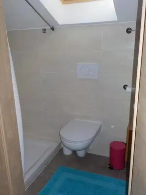 a bathroom with a toilet and a bath tub at Berghütte Plafötschalm in Tires