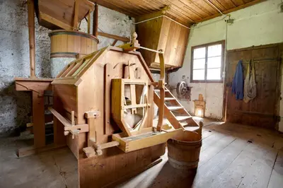 a room with a large machine in a building at Angerle Hof in Nova Levante