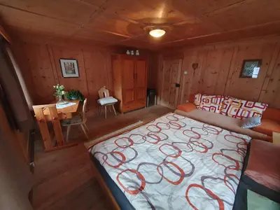 an overhead view of a bedroom with a bed and a table at Apartement Schuster Lake Prags Braies in Braies