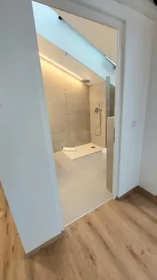 a bathroom with a shower with a glass door at Villa Camilde - elegance and relax in Merano in Merano