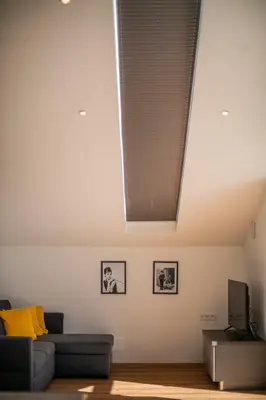 a living room with a ceiling with a skylight at Villa Camilde - elegance and relax in Merano in Merano