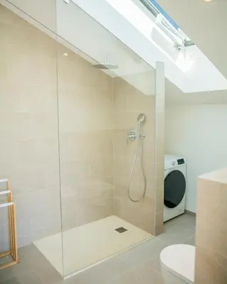 a bathroom with a shower with a toilet and a sink at Villa Camilde - elegance and relax in Merano in Merano