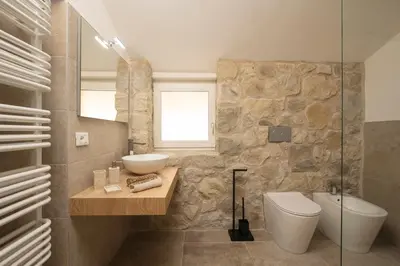 a bathroom with a sink and a toilet at SnowLake Suite & Apartment in Alleghe