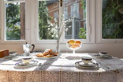 a table with a table cloth with food on it at Apartment Anna in Merano