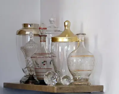 a group of glass vases sitting on a shelf at APARTMENT im garten 9 in Gargazzone