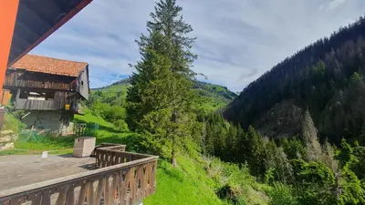a view from a balcony of a house in the mountains at Appartamenti Nonno Gianni in Rocca Pietore