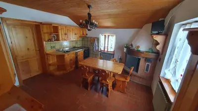 an overhead view of a kitchen with a table and chairs at Appartamenti Nonno Gianni in Rocca Pietore