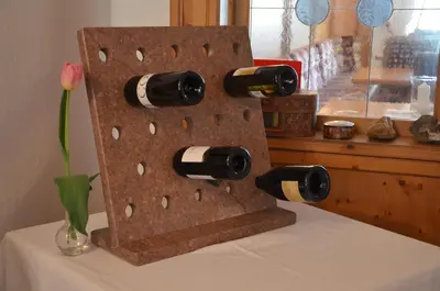 a display of wine bottles on top of a table at Hotel Greifenstein in Terlano