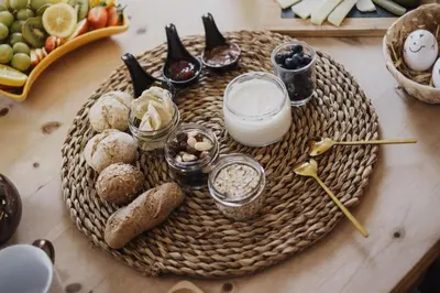a table with a tray of food on a table at Töllhof Studio Stube in Bressanone