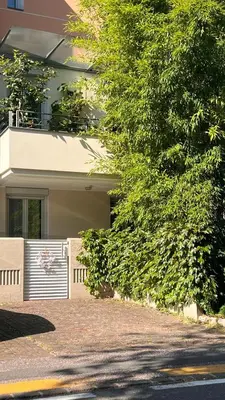 a house with a gate in front of it at Garden Suite in Bolzano