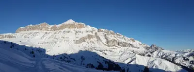 a mountain covered in snow on a clear day at Appartamenti Dany in Arabba