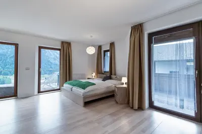 a view of a mountain through a window at Apartments Markus in Ortisei