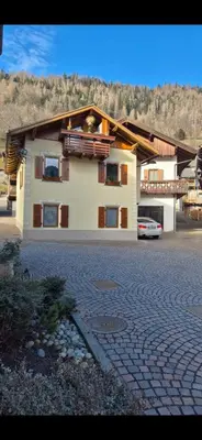 a large house with a car parked in front of it at Casa Jasmina in Mezzano