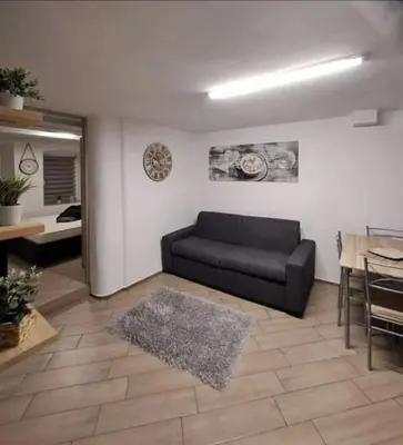 a living room with a couch and a table at Casa Jasmina in Mezzano