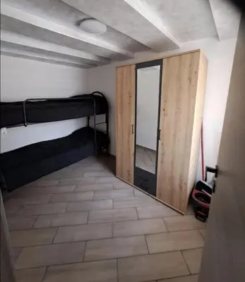 a room with two bunk beds and a mirror at Casa Jasmina in Mezzano