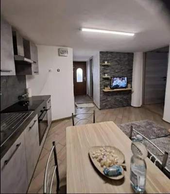 a kitchen with a table and a dining room at Casa Jasmina in Mezzano