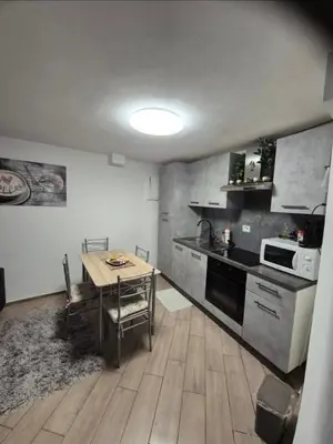 a kitchen with a table and a kitchen with a stove at Casa Jasmina in Mezzano