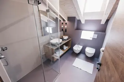 a bathroom with a toilet and a sink and a shower at Flaschtal-Hof in Nova Ponente