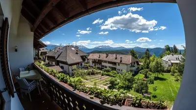 a view from the balcony of a house at Residence Lärchenhäusl in Soprabolzano