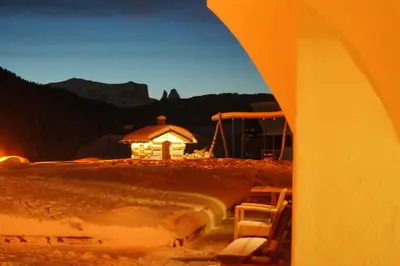 a gazebo with a light in the background at Garni La Majon in Selva di Val Gardena