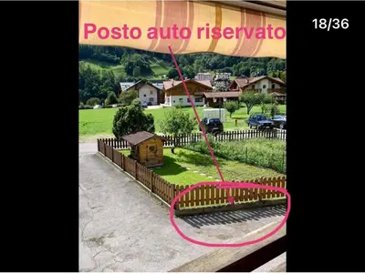 a sign that reads posto articula nervosa with a bench at Appartamento Casa Serena in Siror