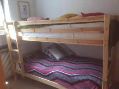 a bunk bed in a room with a bunk bedsheet at BIS Vipiteno in Vipiteno