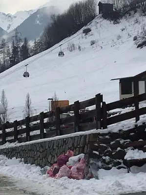 a pile of garbage next to a fence in the snow at BIS Vipiteno in Vipiteno