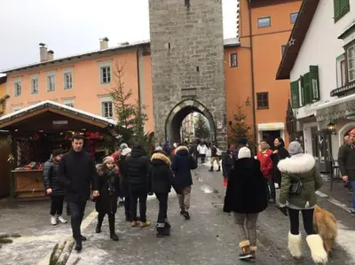a group of people walking down a street at BIS Vipiteno in Vipiteno