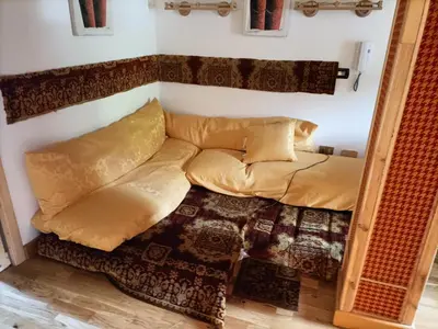 a living room with a couch and a mirror at Resort CuraLibera in Ronzone