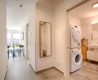 a laundry room with a washer and dryer in it at Apartment Lavendel - Alpstay in Naturno