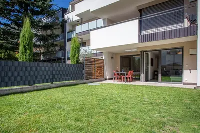 a view of the backyard of a house with a lawn at Apartment Lavendel - Alpstay in Naturno
