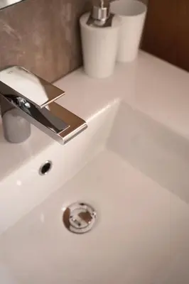 a white bathroom sink with a faucet on it at Apartment Pössnecker in Selva di Val Gardena