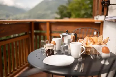 a kitchen with white cabinets and a sink at Oberschoeberlehof in Merano