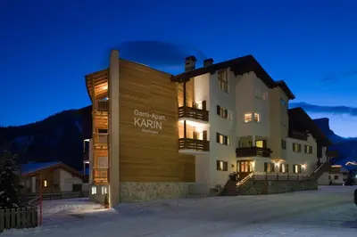 akritkritkrit karavan hotel in the snow at night at Garni Karin in Corvara in Badia
