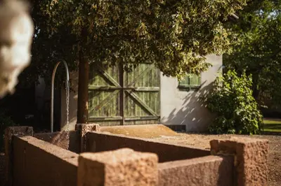 a fence with a large window in front of a building at Agriturismo Insolito in Terlano