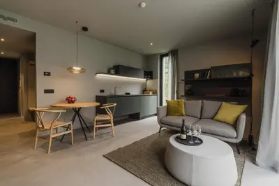 a living room with a couch and a table at Agriturismo Insolito in Terlano