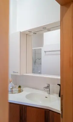 a bathroom with a sink and a mirror at Apartment Perwanger in Appiano sulla Strada del Vino