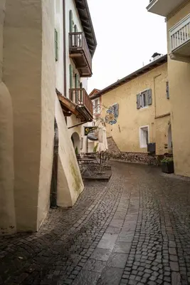 an empty street in a town with buildings at Apartment Perwanger in Appiano sulla Strada del Vino