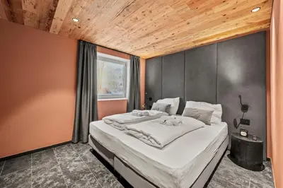 a bedroom with a large bed and a shower at NEW OPENING 