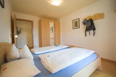 two beds in a room with two at Apartments Dilln Gütl in Tires