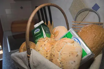 a basket full of bread sitting on a table at Apartments Dilln Gütl in Tires