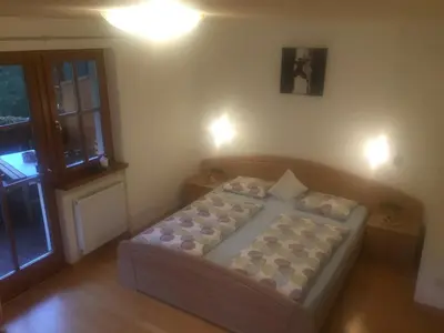a small bedroom with a bed in a room at Apartments Dilln Gütl in Tires
