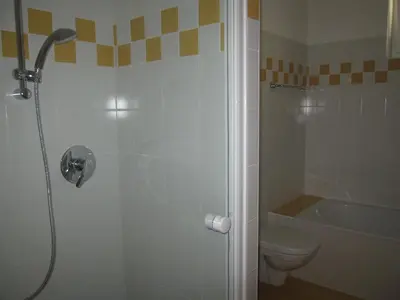a bathroom with a shower and a toilet at Apartment Welscher in Nova Levante