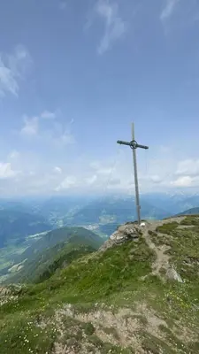 a pole on the top of a mountain at Stroblhof in Vipiteno