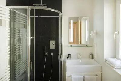 a bathroom with a shower and a sink at Apartments Rondula Pic in Santa Cristina in Val Gardena