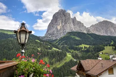 a street light with a view of a mountain at Apartments Rondula Pic in Santa Cristina in Val Gardena