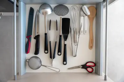 a cupboard filled with lots of kitchen utensils at Apartments Villa Julia in Lana