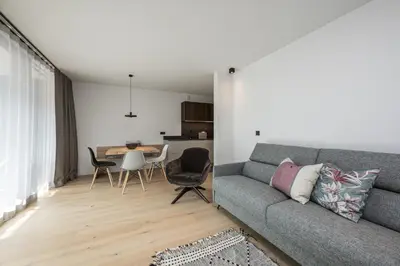 a living room with a couch and a table at Luis Chalet in Brunico