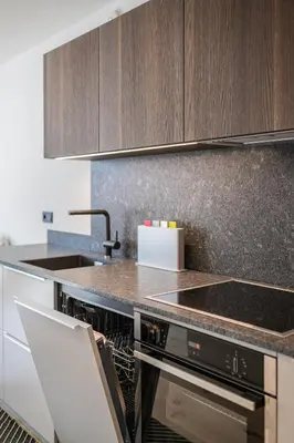 a kitchen with a counter and a stove top oven at Luis Chalet in Brunico